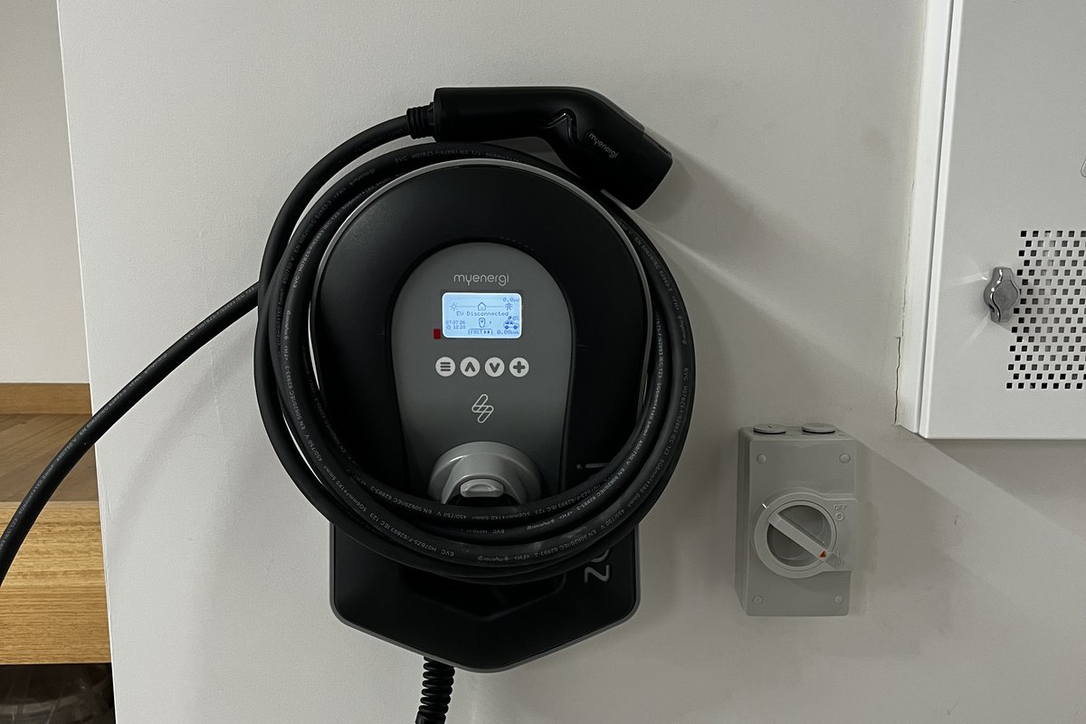 myenergi Zappi EV charger installed on a home wall with the cable holster, installed by SALTD Electrical